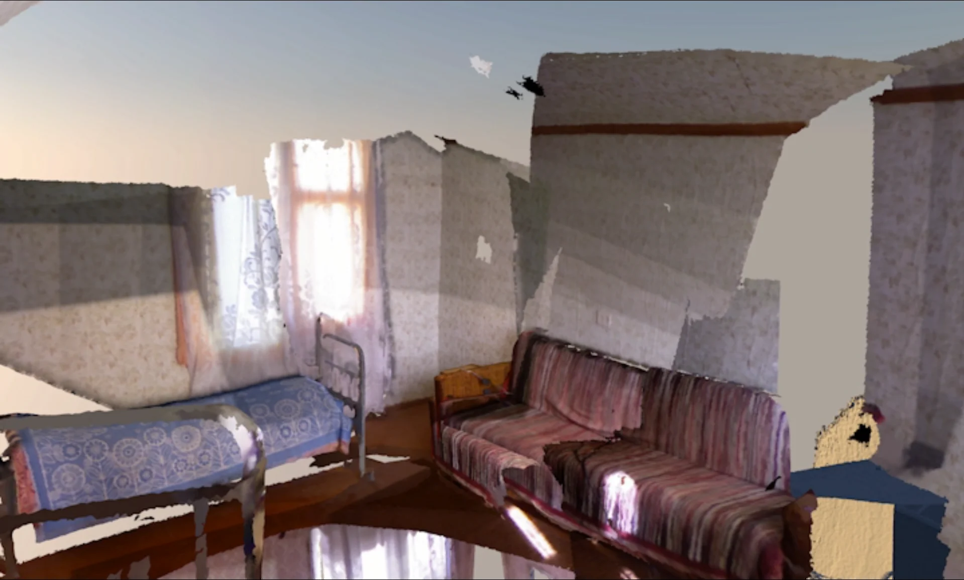 A bed and sofa in the partial room reconstruction