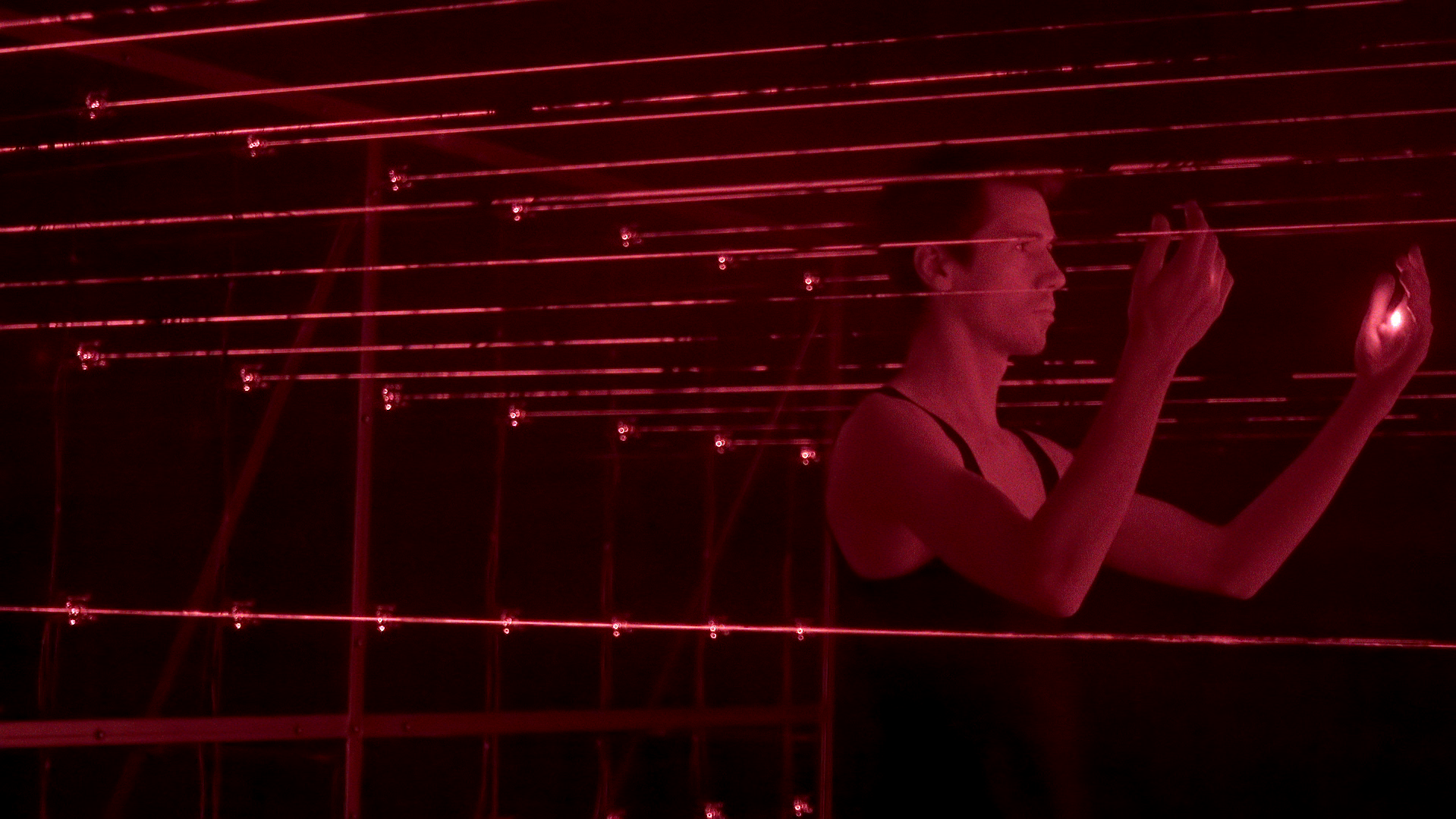 A participant bringing their hands into the laser field.