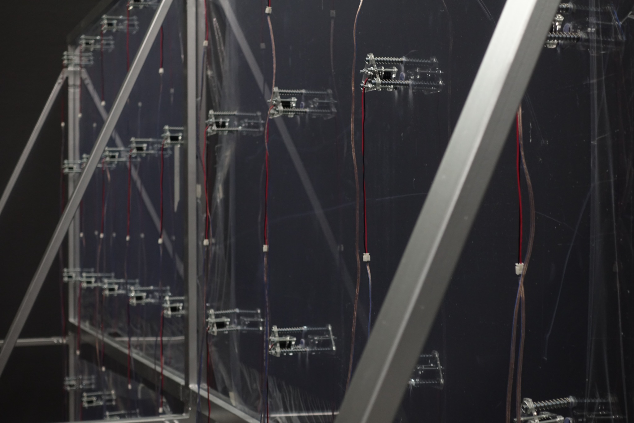 Laser mounts with spring-loaded fasteners on the glass panels.