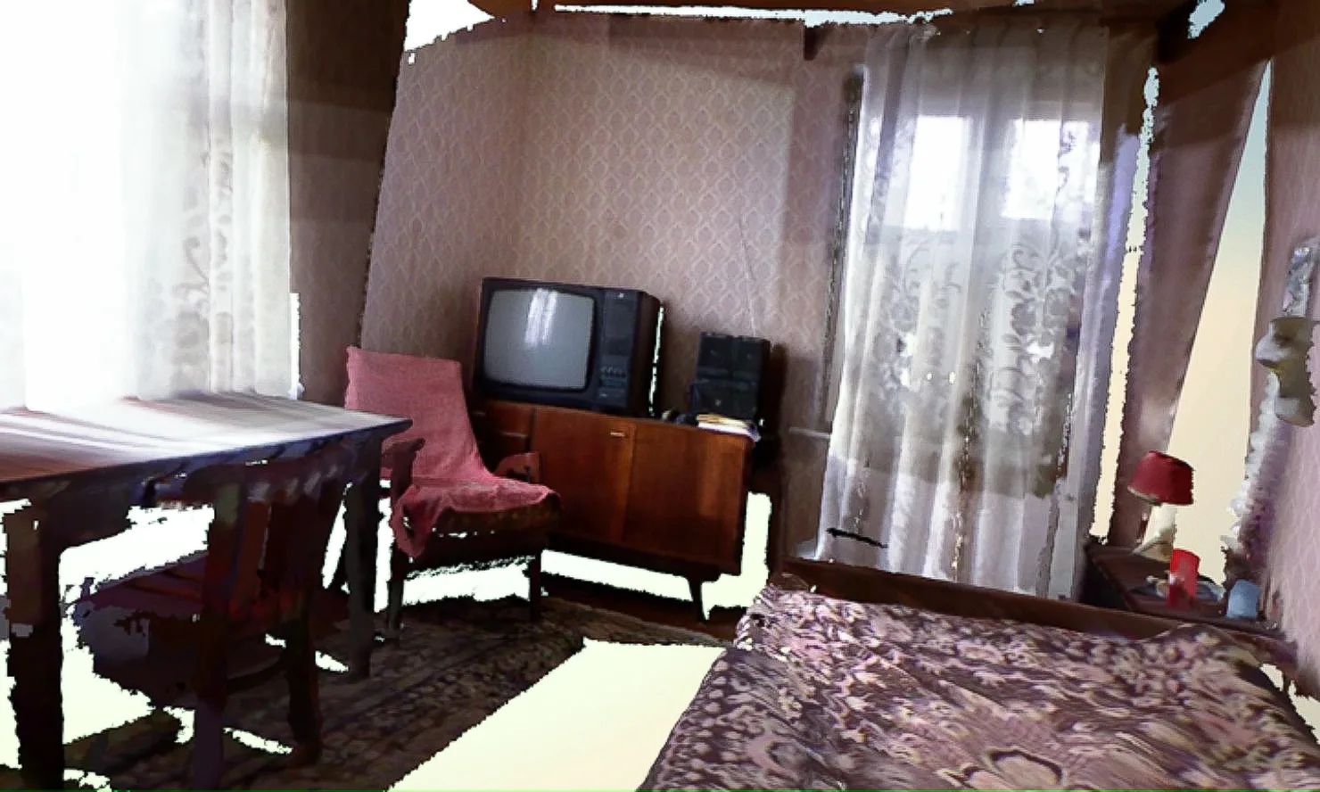 Partial 3D scan of a furnished room with missing geometry